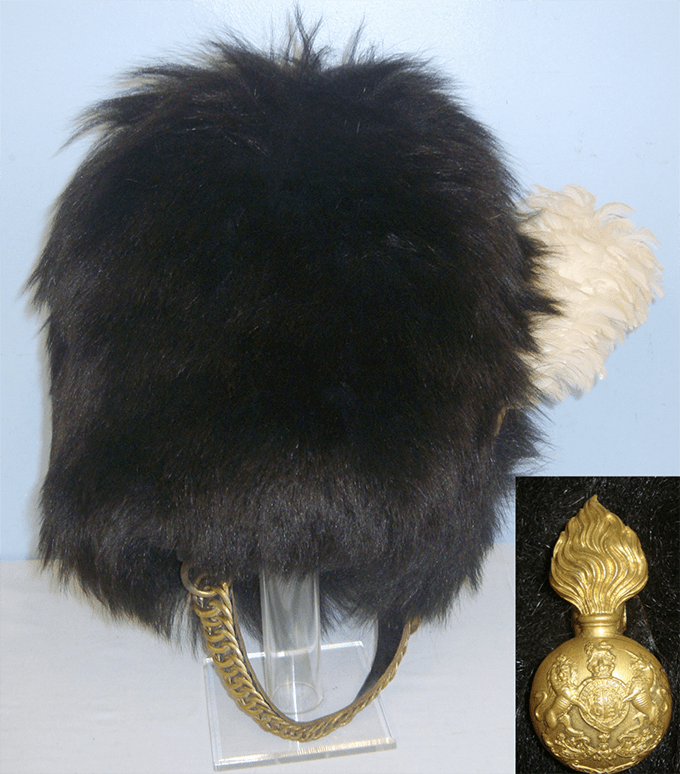 Grenadier Guards regimental brass badge and a white feather plume, liner & chin strap.