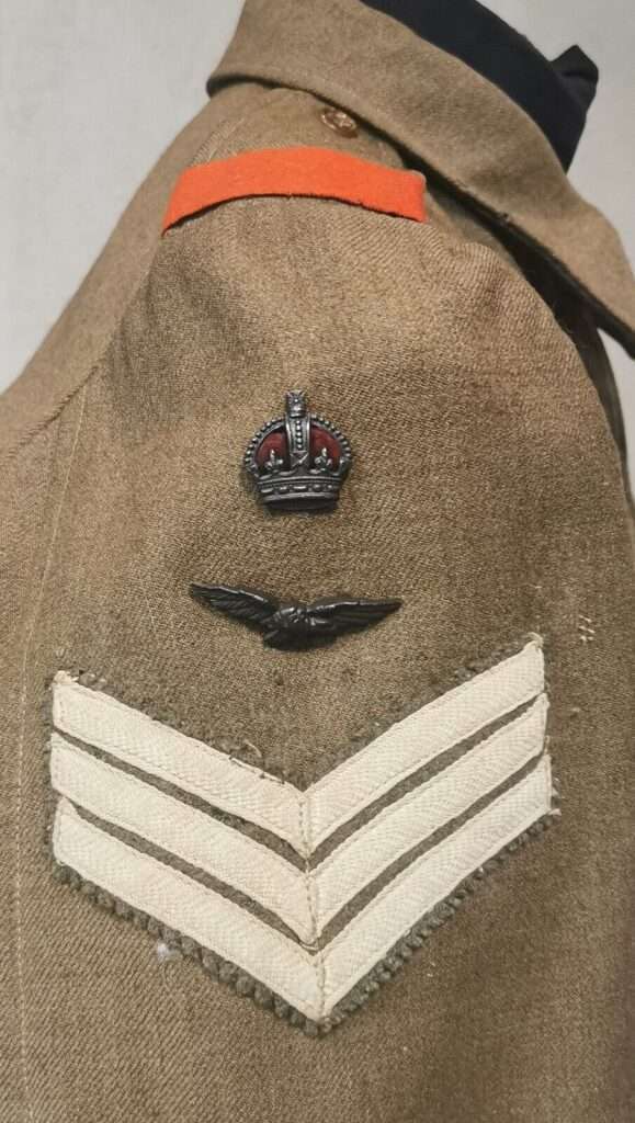 RAF Sgt's stripes, eagle and kings crown.