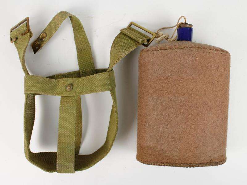 WW1 British Army water bottle and webbing carrier.